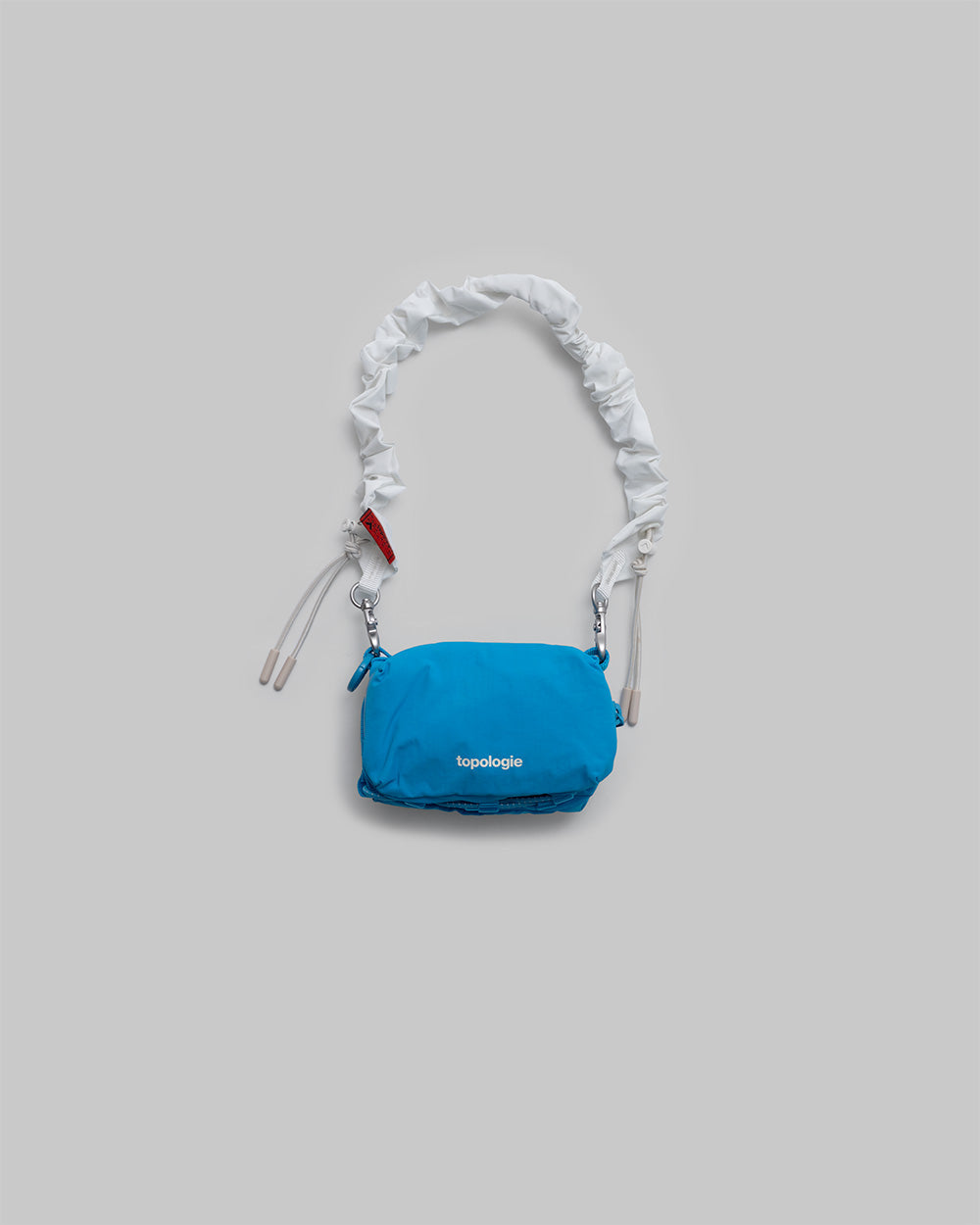 Mini sacoche pour bouteille / Bleu atomique / Dragonne élastique / Marshmallow
